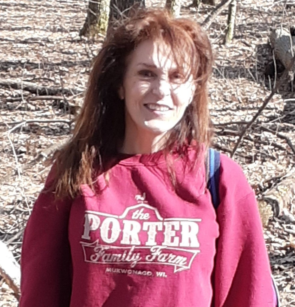 Ali Porter smiling outdoors on the Porter Family Farm in Mukwonago, Wisconsin